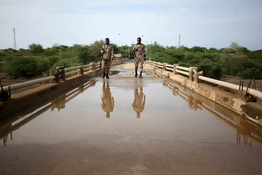 Members of Amhara special forces stand guard on the Tekeze river bridge near Ethiopia-Eritrean border near the town of Humera, Ethiopia on July 1, 2021.