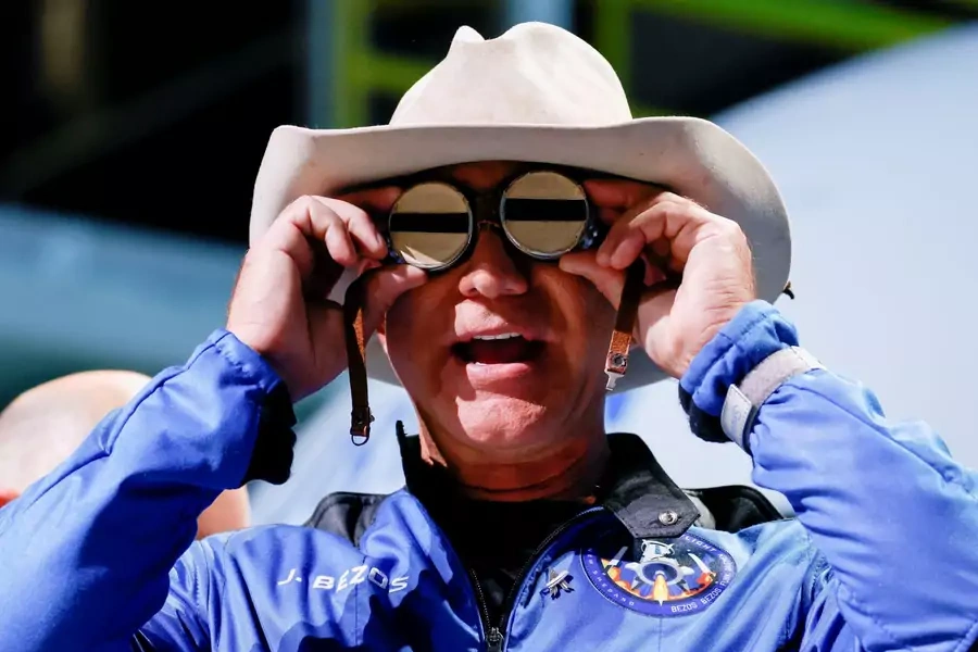 Billionaire American businessman Jeff Bezos wears goggles owned by Amelia Earhart which he carried into space at a post-launch press conference after he flew on Blue Origin's inaugural flight to the edge of space, in the nearby town of Van Horn, Texas on 