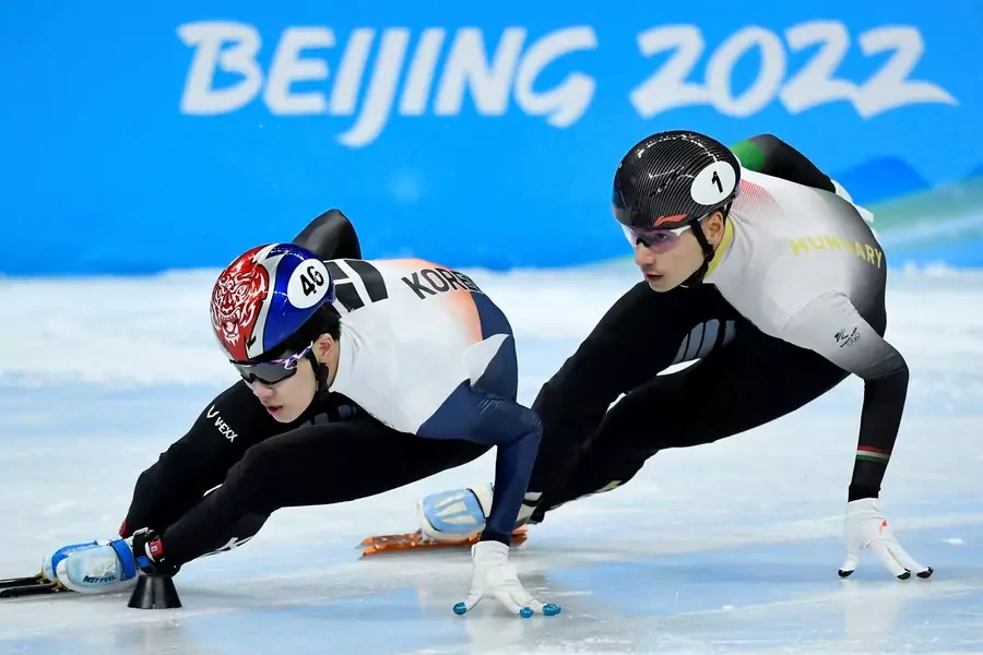 Lee June-seo of South Korea and Shaoang Liu of Hungary during the Short Track Speed Skating Men's 1000m Quarterfinals for the 2022 Beijing Olympics on February 7, 2022.