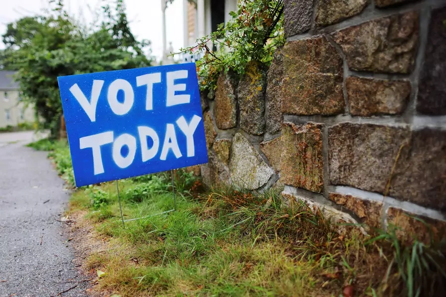 A sign reminds voters to cast their ballots on Primary Election Day in Gloucester, Massachusetts on September 6, 2022