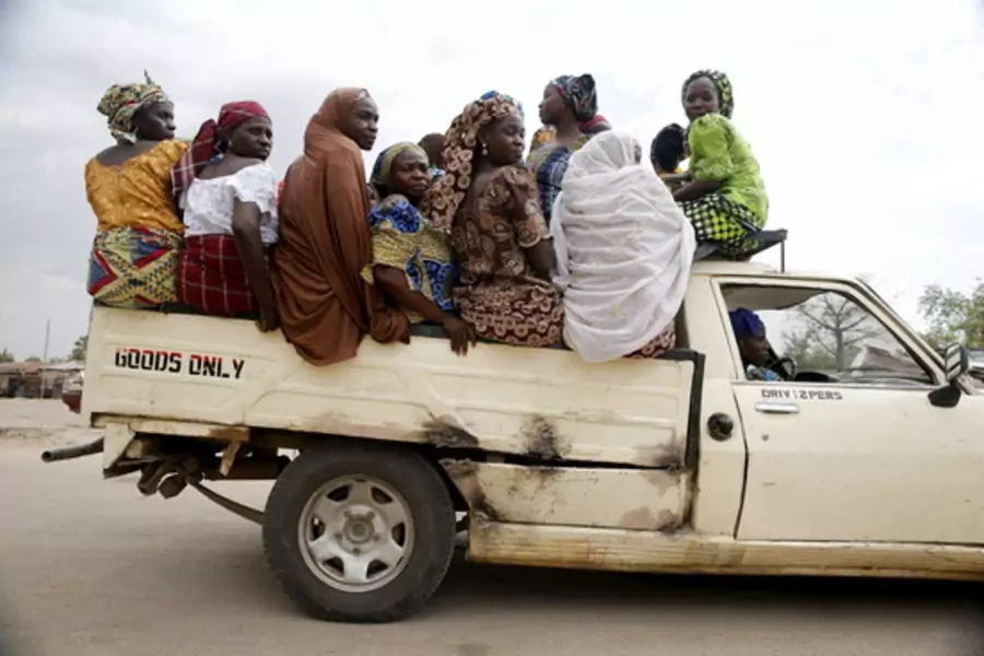 Women travel in the back of a truck in the town of Mararaba, after the Nigerian military recaptured it from Boko Haram, in Adamawa state.