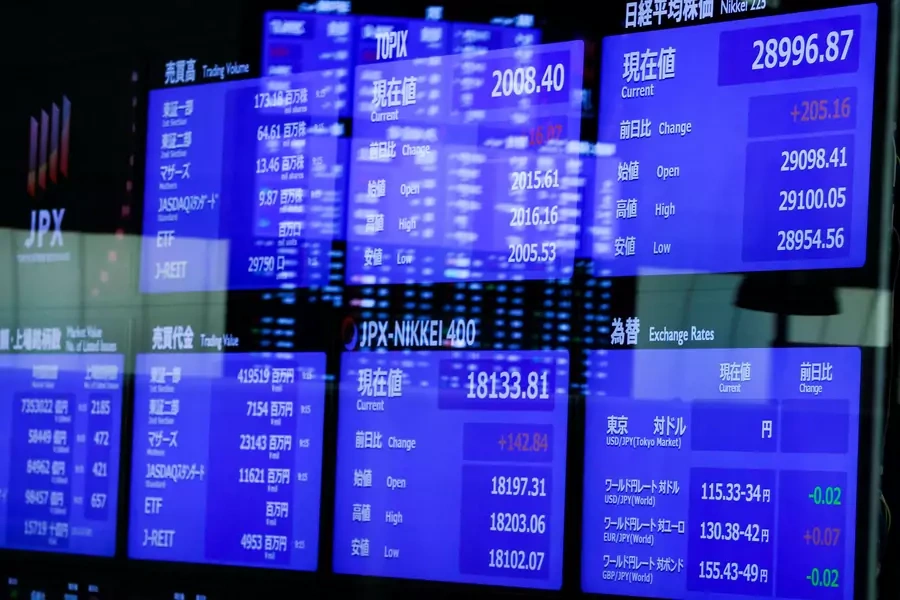 Monitors displaying the stock index prices and Japanese yen exchange rate against the U.S. dollar at the Tokyo Stock Exchange