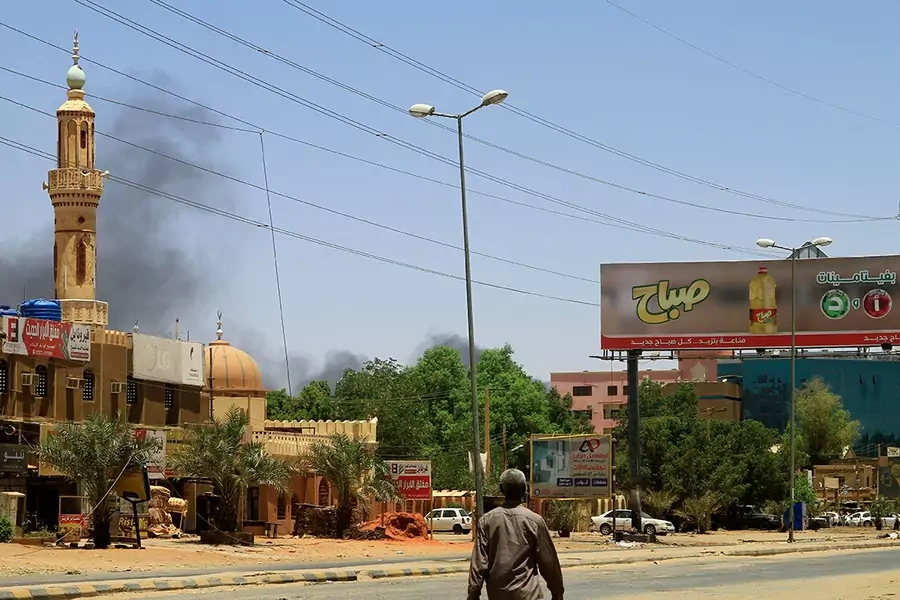 Smoke rises behind a mosque as fighting between the Sudanese Armed Forces and paramilitary Rapid Support Forces raged for a fifth day, in Khartoum, Sudan on April 19, 2023.