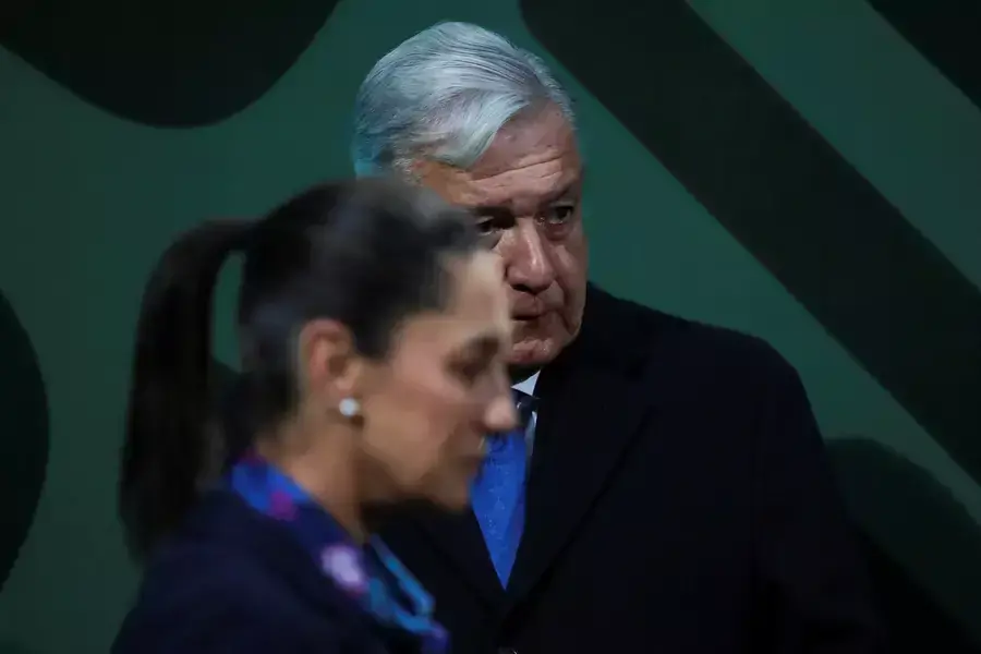 Mexico City’s Governor Claudia Sheinbaum walks past Mexico’s President Andrés Manuel López Obrador during a news conference in Mexico City, Mexico, January 20, 2023.