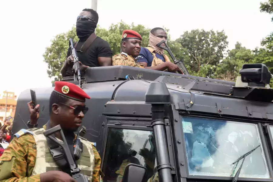 Burkina Faso's self-declared new leader Ibrahim Traore arrives at the national television standing in an armored vehicle in Ouagadougou, Burkina Faso on October 2, 2022.