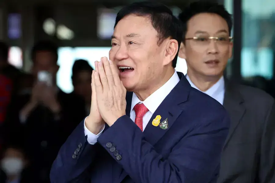 Former Thai Prime Minister Thaksin Shinawatra gestures at Don Mueang airport in Bangkok, Thailand, on August 22, 2023. 