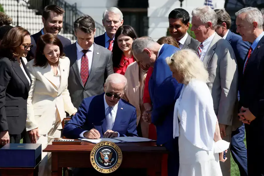 U.S. President Joe Biden signs into law the CHIPS and Science Act on August 9, 2022 at the South Lawn of the White House