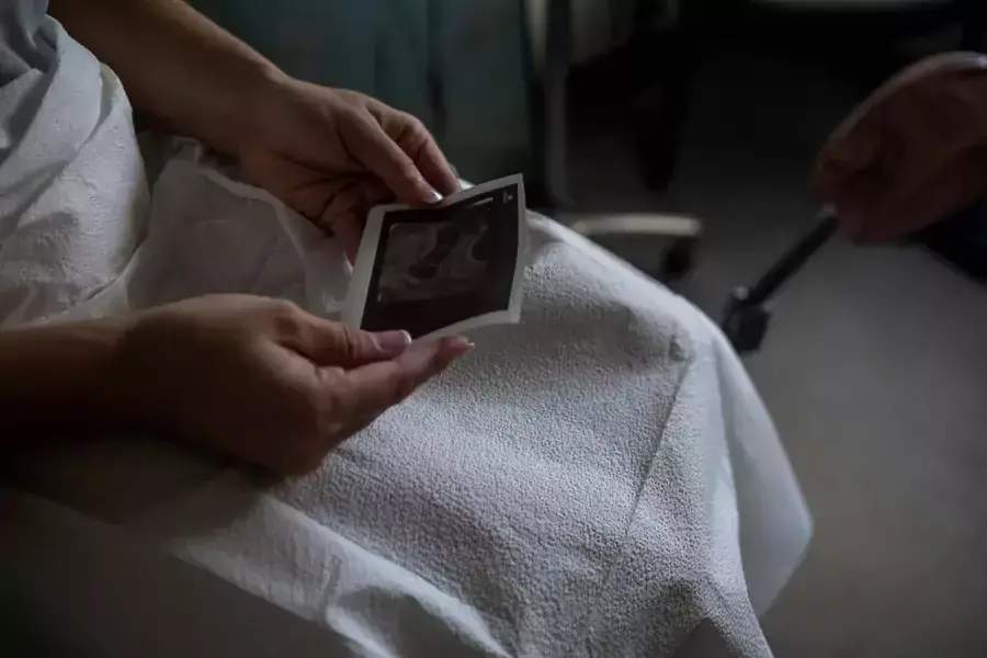 A patient looks at her ultrasound before proceeding with a medical abortion at Alamo Women's Clinic in Albuquerque, New Mexico, U.S., August 23, 2022. 