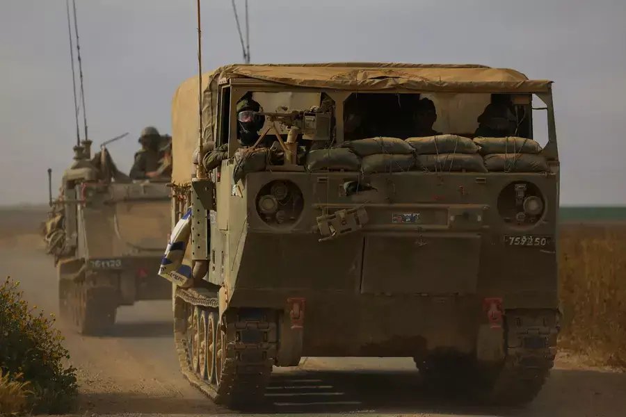 Israeli military personnel drive near the Israel-Gaza border on April 3, 2024.