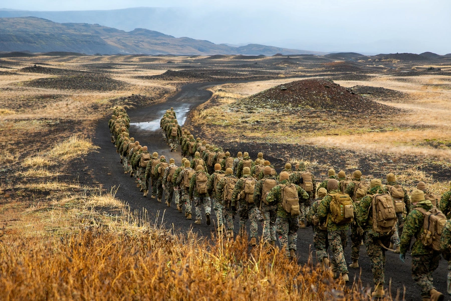 U.S. Marines with the 24th Marine Expeditionary Unit, deployed during Exercise Trident Juncture 18, hike to a cold-weather training site inland in Iceland, October 19, 2018