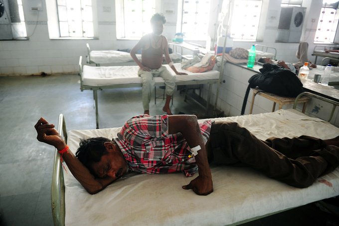 Indian diarrhoea patient Hari Sankar Gupta lies on a bed in a government hospital in Allahabad