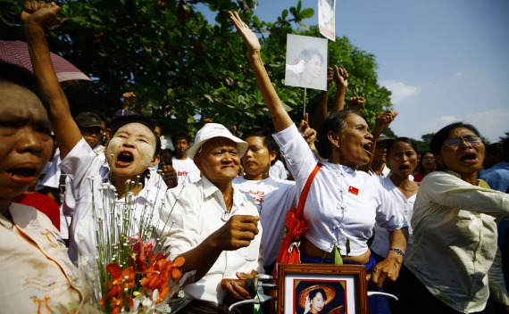 Members of the National League for Democracy (NLD) party shout during a protest outside the house of their leader, Aung San Suu Kyi, in Yangon on November 13, 2010.