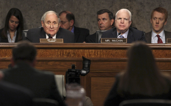 U.S. General David Petraeus and Flournoy speak to Levin and McCain at a Senate hearing on Capitol Hill in Washington.