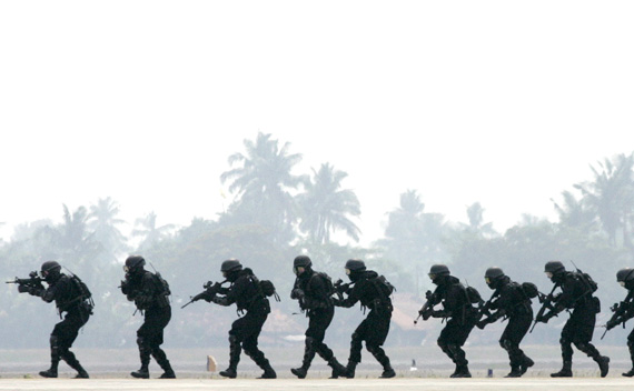 Members of the Indonesian police elite anti-terrorist unit take part in a drill at Sukarno-Hatta airport in Jakarta