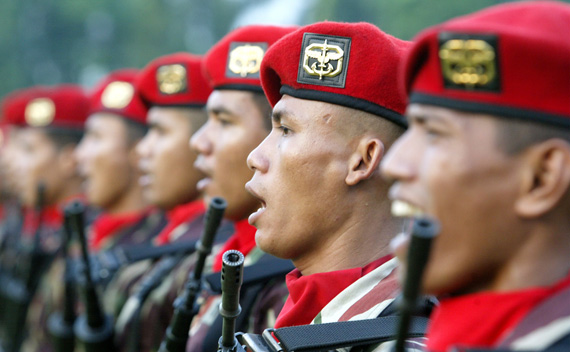 Kopassus soldiers sing during a ceremony