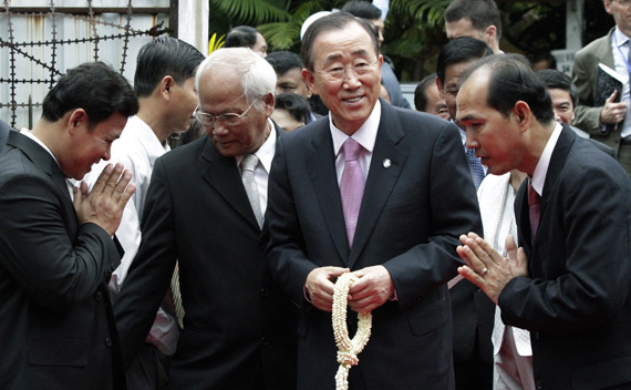 U.N. Secretary-General Ban is greeted by museum officials at Tuol Sleng Genocide Musuem in Phnom Penh on the last day of his official visit