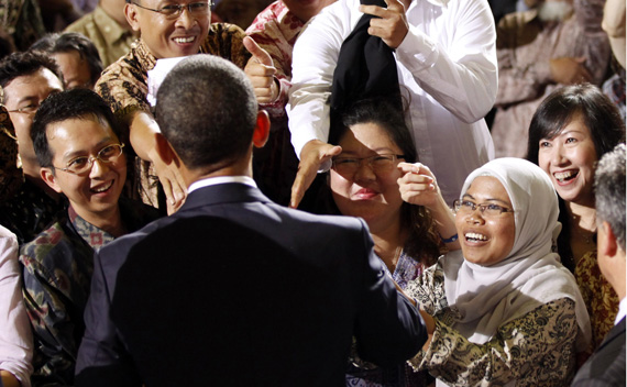 U.S. President Barack Obama greets members of the audience after delivering a speech at the University of Indonesia in Jakarta