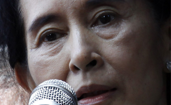 Aung San Suu Kyi addresses supporters outside the headquarters of her National League for Democracy party in Yangon