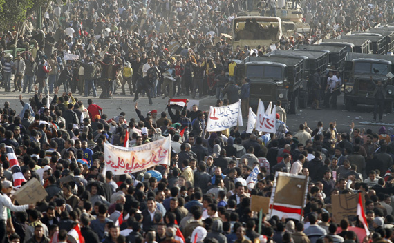 Pro-government demonstrators face-off against anti-Mubarak supporters near Tahrir Square in Cairo