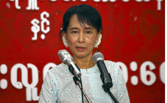 Myanmar’s pro-democracy leader Aung San Suu Kyi speaks with youths at the National League for Democracy head office in Yangon