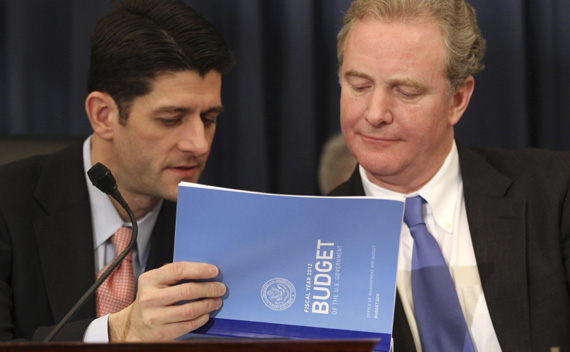 U.S. House Budget Committee Chairman Paul Ryan (L) (R-WI) looks at a copy of U.S. President Barack Obama’s 2012 budget with ranking Democrat Chris Van Hollen (R) (D-MD). (Jason Reed/Courtesy Reuters)