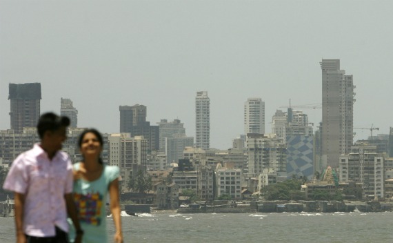 A couple walk at the seafront in Mumbai on May 11, 2009.