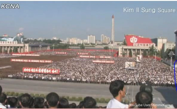 North Koreans shout slogan during a massive rally at Kim Il Sung Square in Pyongyang, North Korea, to denounce the conservative government of South Korean President Lee Myung-bak on July 4, 2011. 