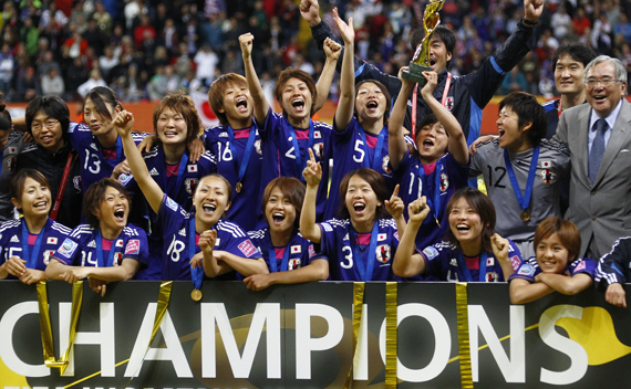 Japan’s players celebrate with the trophy after the victory against the U.S. in their Women’s World Cup final soccer match in Frankfurt July 17, 2011.