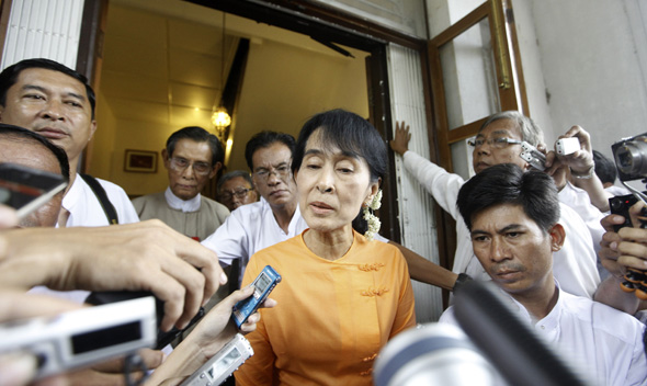 Aung San Suu Kyi talks to reporters after meeting Tomas Ojea Quintana, U.N. special envoy on human rights in Myanmar, at Suu Kyi’s home in Yangon August 24, 2011.