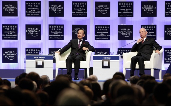 China’s Premier Wen Jiabao and Klaus Schwab, founder and executive chairman of the World Economic Forum (WEF), attend the opening ceremony of the WEF Annual Meeting of the New Champions in northeastern China’s port city of Dalian on September 14, 2011.