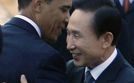 U.S. President Barack Obama gets a hug from South Korean President Lee Myung-bak at the Blue House in Seoul, November 19, 2009.