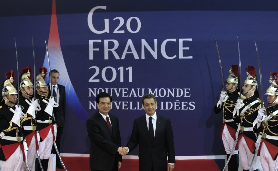 France’s President Nicolas Sarkozy welcomes China’s President Hu Jintao at the G20 venue where world leaders gather in Cannes on November 2, 2011.