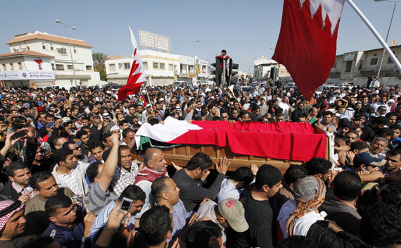 People carry the body of a protester killed on Monday, February 14, 2011 in Bahrain.