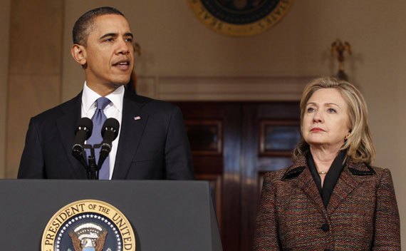President Barack Obama speaks about Libya as Secretary of State Hillary Clinton listens in the White House on February 23, 2011. 