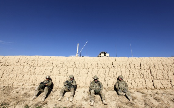 U.S. Army soldiers sit behind a wall after an IED blast in Logar province on November 23, 2011 (Umit Bektas/Courtesy Reuters).