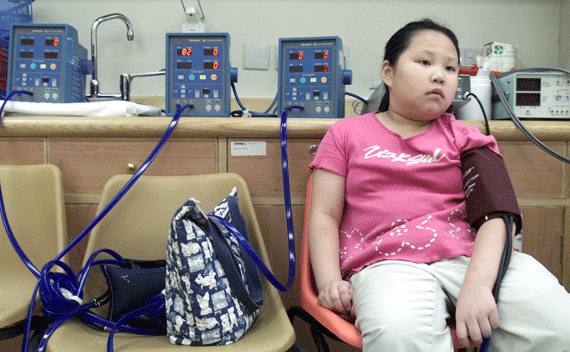 A nine-year-old girl has her blood pressure checked as she takes part in a research project on childhood obesity at a hospital in Hong Kong. Obesity, a disease linked with increased risks of asthma, heart diseases, diabetes, high blood pressure and certain cancers, has become one of the biggest health threats facing many industrialised countries. Around 13 percent of Hong Kong children are classified as obese and doctors say it has been on the up since the early 1990s.