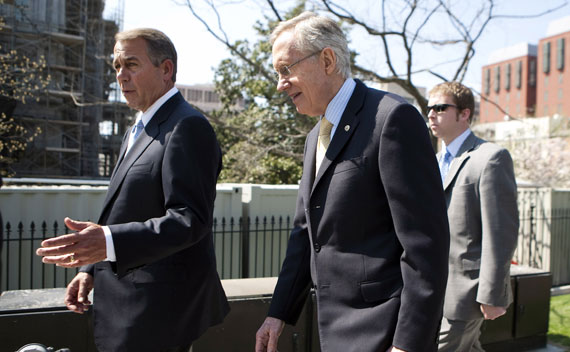 John Boehner (R-OH) and Harry Reid (D-NV) walk together after speaking with President Obama about the continuing budget negotiations on April 7, 2011.