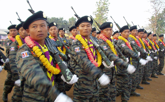 Military personnel from the Democratic Karen Buddhist Army (DKBA), an ethnic militia battling Myanmar’s military junta, take part in a traditional New Year’s parade on the Myanmar-Thai border