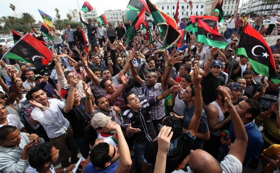 Residents celebrate at Martyrs square in Tripoli October 20, 2011 after hearing the news that former leader Muammar Gaddafi was killed in Sirte (Ismail Zetouni/Courtesy Reuters).