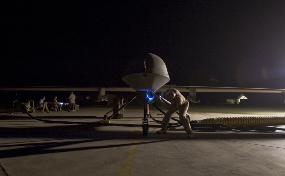 Lt. Col. Geoffrey Barnes, Detachment 1 46th Expeditionary Reconnaissance Attack Squadron commander, performs a pre-flight inspection of an MQ-1B Predator unmanned drone aircraft on September 3, 2008 (Christopher Griffin/Courtesy Reuters).