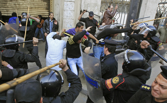 Riot police clash with protesters in Cairo January 26, 2011. 