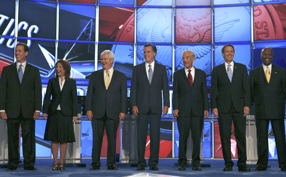 Republican presidential hopefuls (L-R) former Senator Rick Santorum (R-PA), Rep. Michele Bachmann (R-MN), former Speaker of the House of Representatives Newt Gingrich (R-GA), former Massachusetts Governor Mitt Romney, Rep. Ron Paul (R-TX), former Minnesota Governor Tim Pawlenty, and former Godfather’s Pizza CEO Herman Cain at the GOP debate in Manchester, New Hampshire on June 13, 2011. (Joel Page/courtesy Reuters) 
