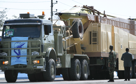 An Iranian Shahab 3 missile passes by during a military parade to commemorate the start of the 1980-88 Iran-Iraq war in Tehran, September 21, 2004. Iran will use a modified version of its Shahab-3 missile, which defence experts say can reach Israel or U.S. bases in the Gulf, to launch a test satellite before March 2005, a defence industry source says. REUTERS/Morteza Nikoubazl CJF/DL