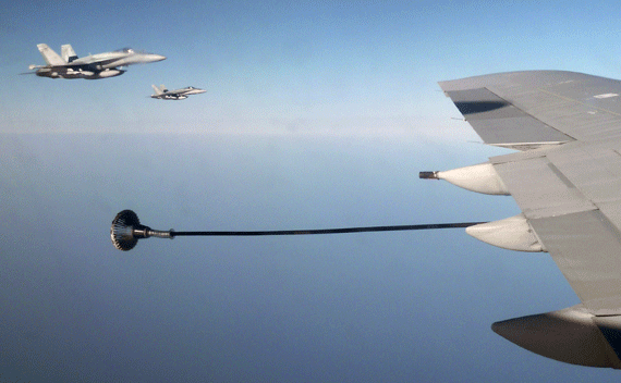 Canadian F-18 war planes wait to refuel from a British VC-10 tanker aircraft over the Mediterranean Sea off Libya