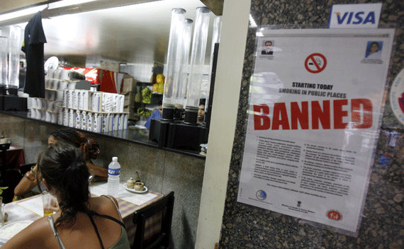 A no-smoking poster is displayed in a restaurant in Mumbai that used to allow smoking October 2, 2008. India banned smoking in public places on Thursday in an attempt to fight tobacco use blamed, directly or indirectly, for a fifth of all deaths in the world’s third-largest consumer. The ban, which includes all offices and restaurants, will hit its estimated 240 million tobacco users, who are likely to find their homes and cars among the last few places to light up. REUTERS/Arko Datta 