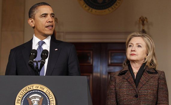 President Barack Obama speaks about Libya as Secretary of State Hillary Clinton listens in the White House in Washington