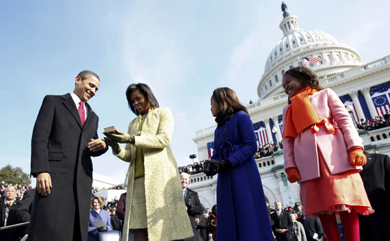 U.S. President Barack Obama and his wife Michelle examine the bible used for his swearing-in ceremony in Washington