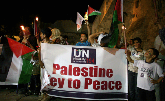 Palestinians take part in a candle light rally to show support for the Palestinian bid for full United Nations membership this month, outside the Church of the Nativity, in the West Bank town of Bethlehem, September 15, 2011. REUTERS/Ammar Awad