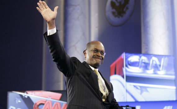 U.S. Republican presidential candidate businessman Herman Cain takes the stage at the start of the CNN GOP National Security debate in Washington, November 22, 2011. REUTERS/Jim Bourg