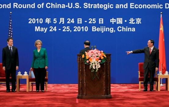 China’s Vice Premier Wang Qishan gestures to U.S. Treasury Secretary Timothy Geithner and U.S. Secretary of State Hillary Clinton during the opening ceremony of the China-U.S. Strategic and Economic Dialogue in Beijing